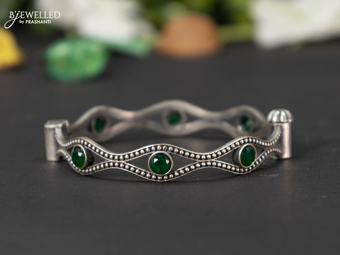 Oxidised screw type bangle with emerald stones