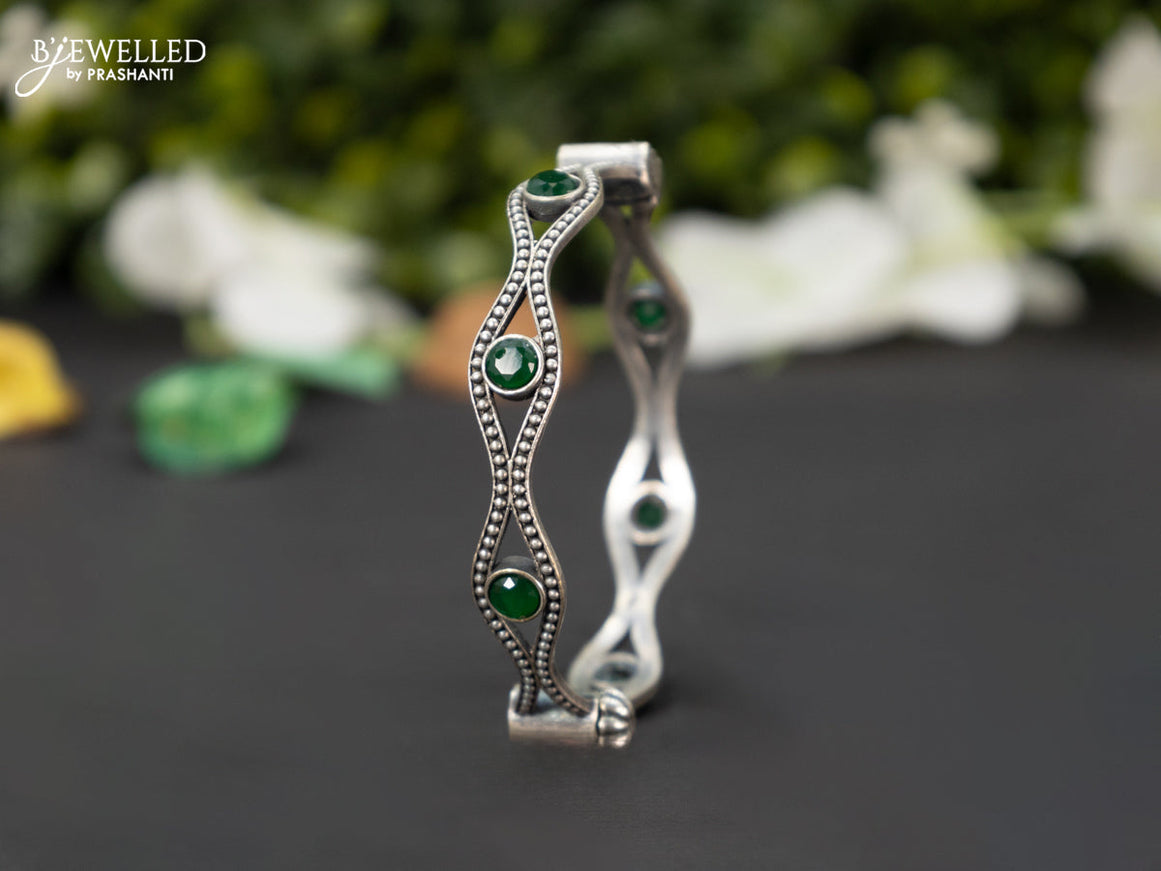 Oxidised screw type bangle with emerald stones