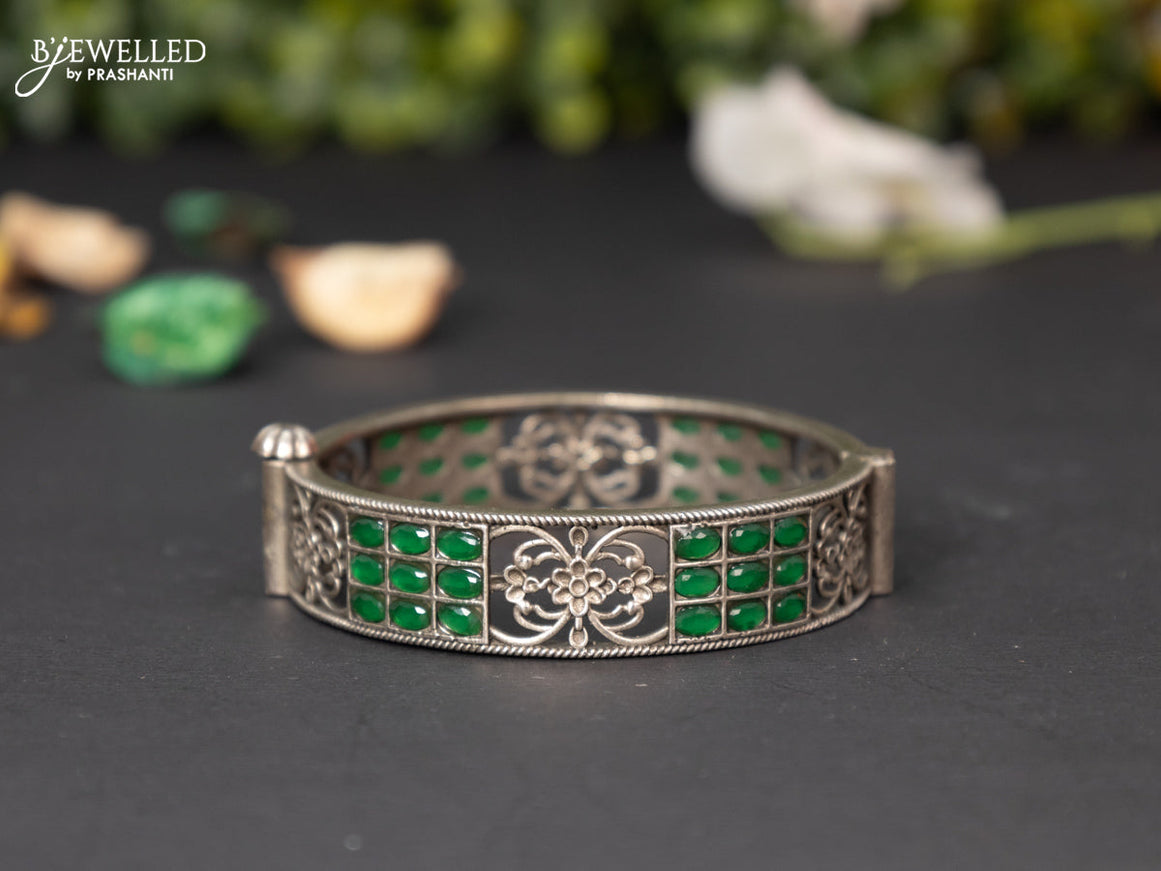 Oxidised screw type bangle with emerald stones