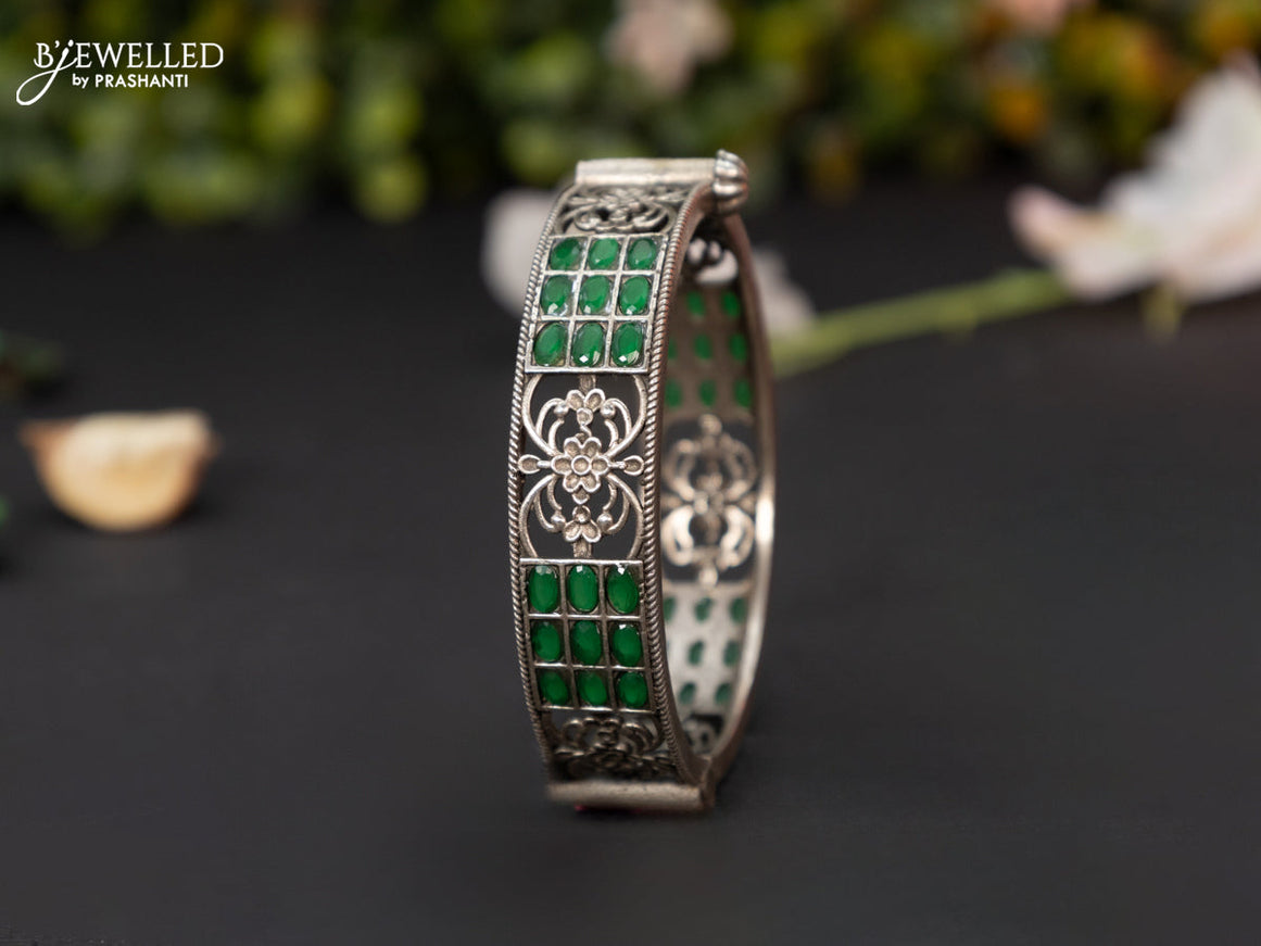 Oxidised screw type bangle with emerald stones