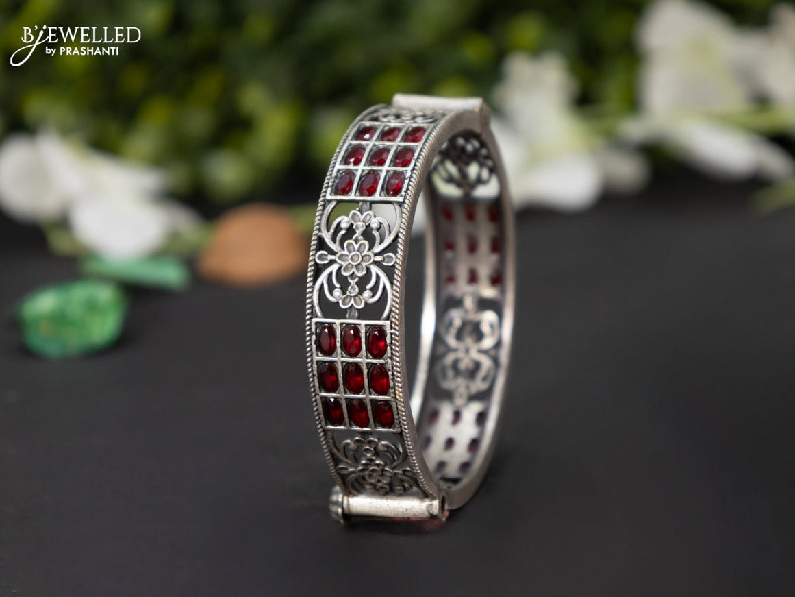 Oxidised screw type bangle with ruby stones