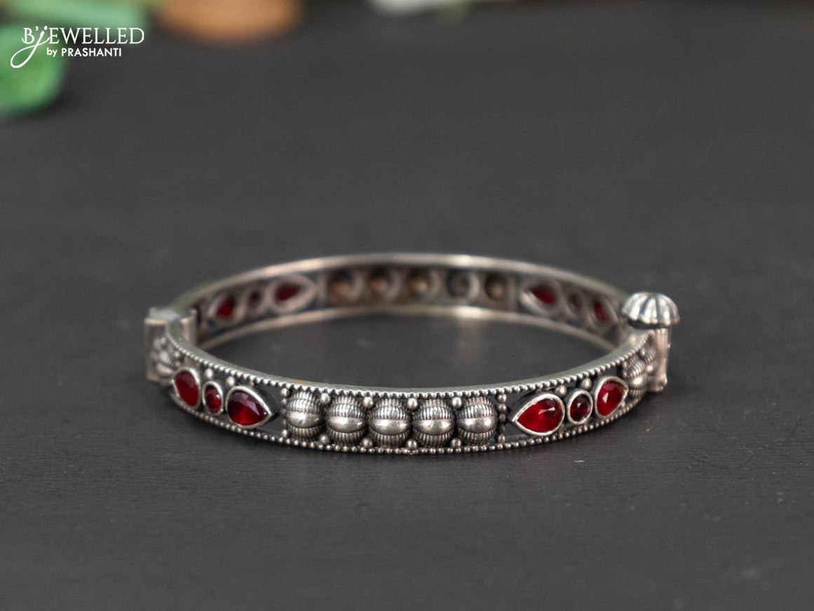 Oxidised screw type bangle with ruby stones