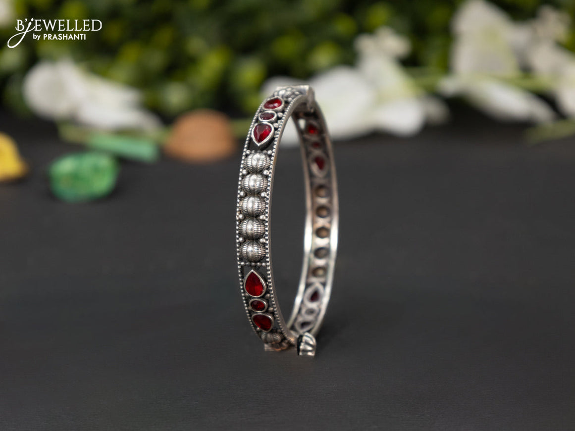 Oxidised screw type bangle with ruby stones