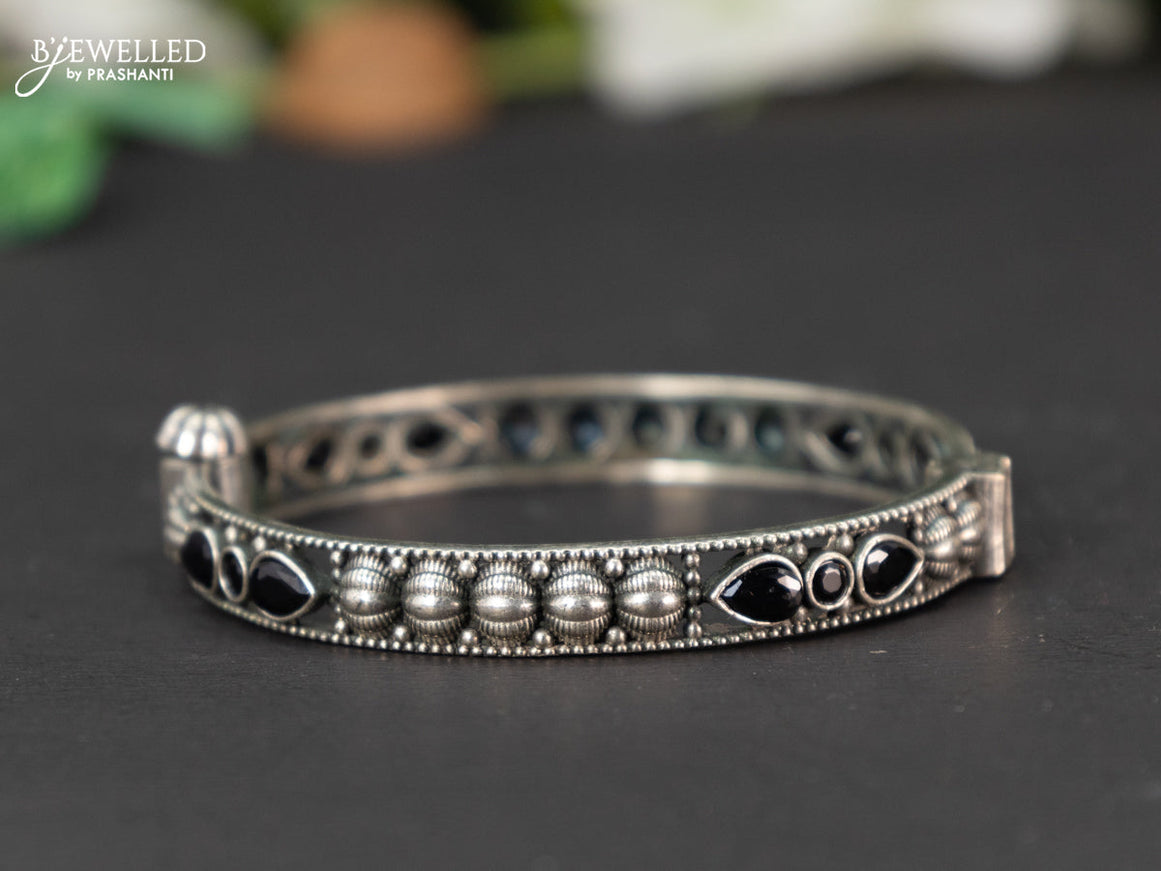 Oxidised screw type bangle with black stones