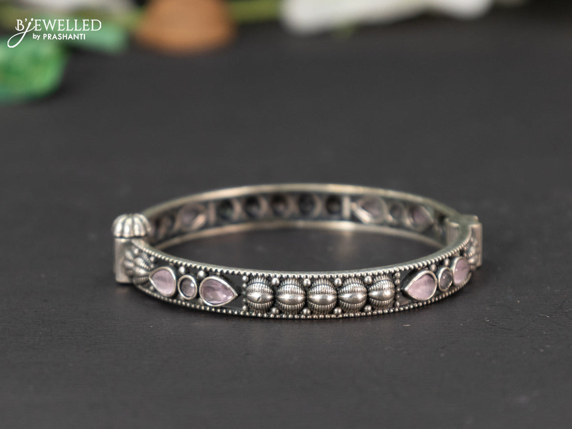 Oxidised screw type bangle with baby pink stones