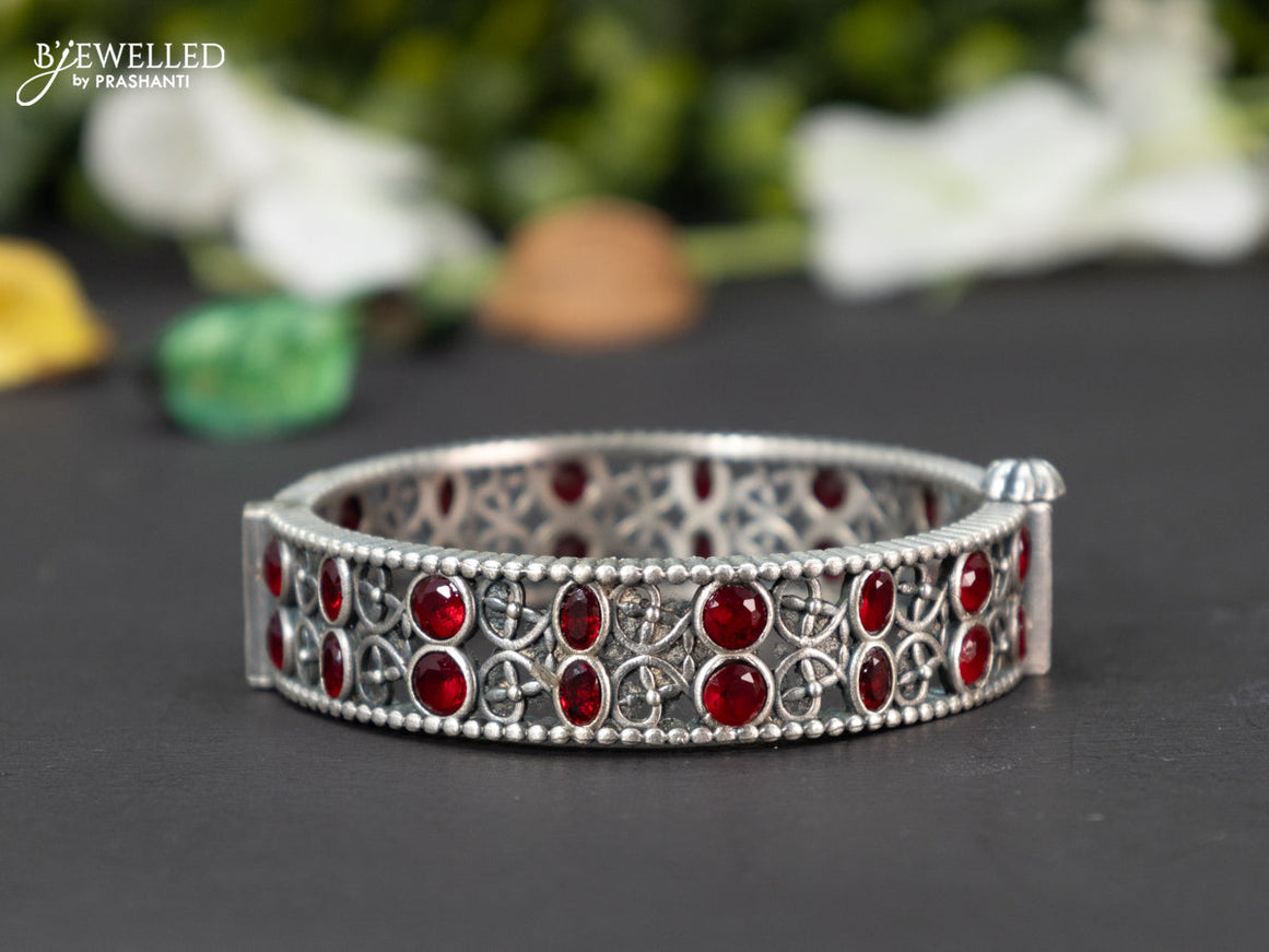 Oxidised screw type bangle with ruby stones