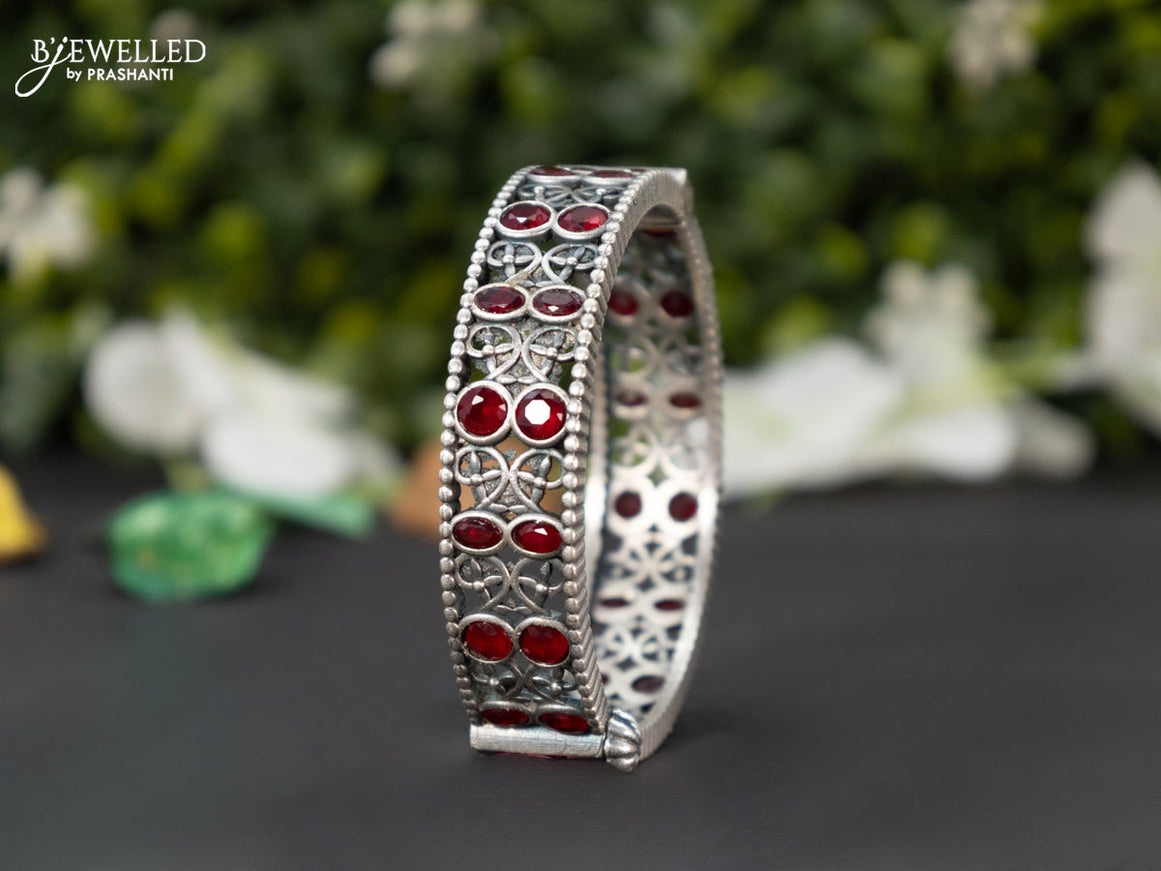 Oxidised screw type bangle with ruby stones