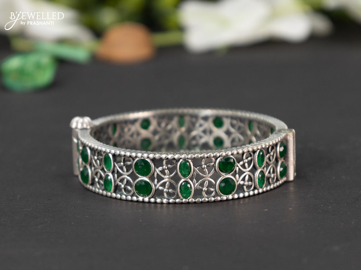 Oxidised screw type bangle with emerald stones