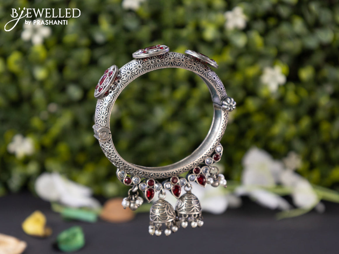 Oxidised screw type bangle with ruby & cz stones and hangings