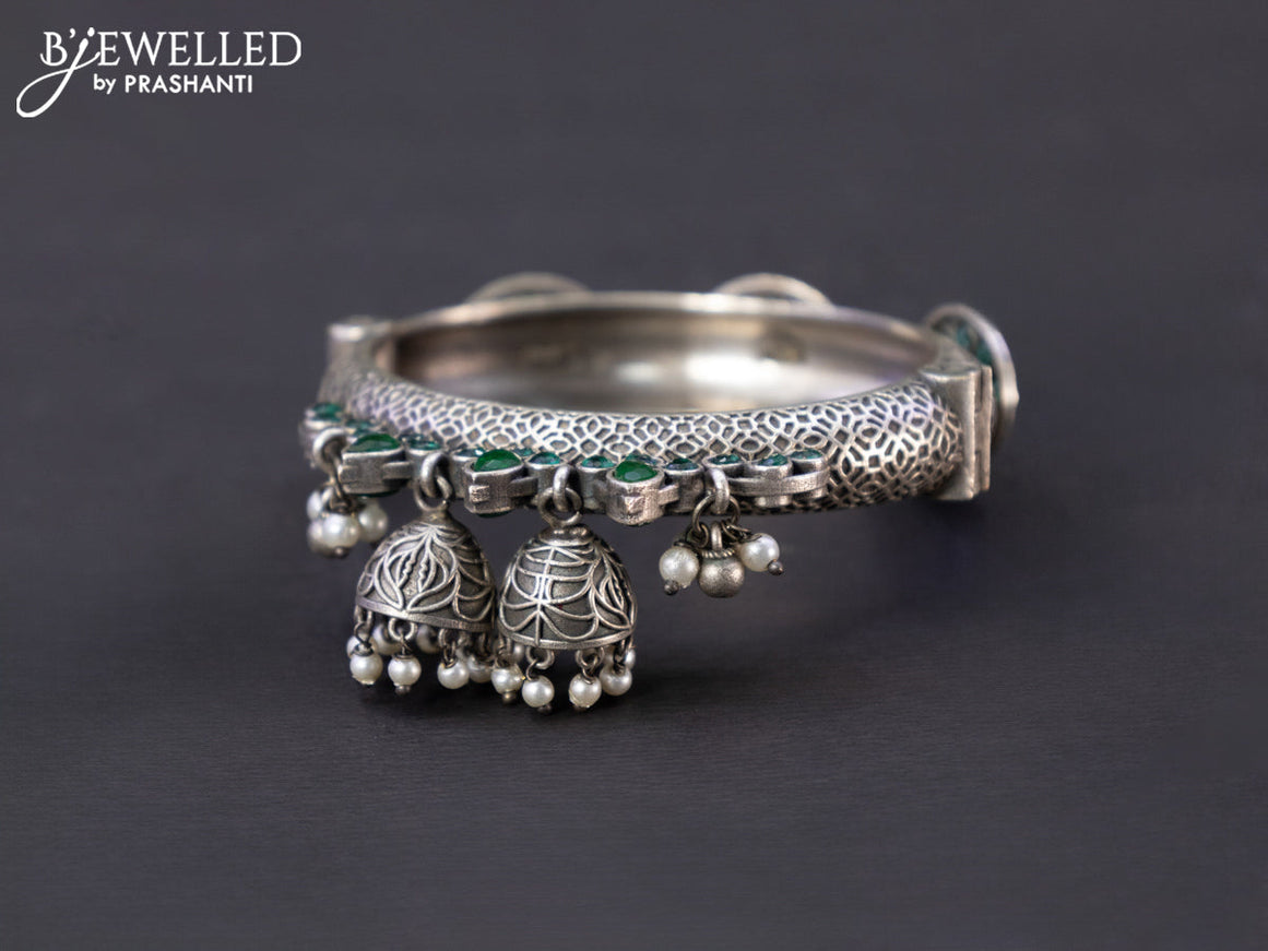 Oxidised screw type bangle with emerald stones and hangings