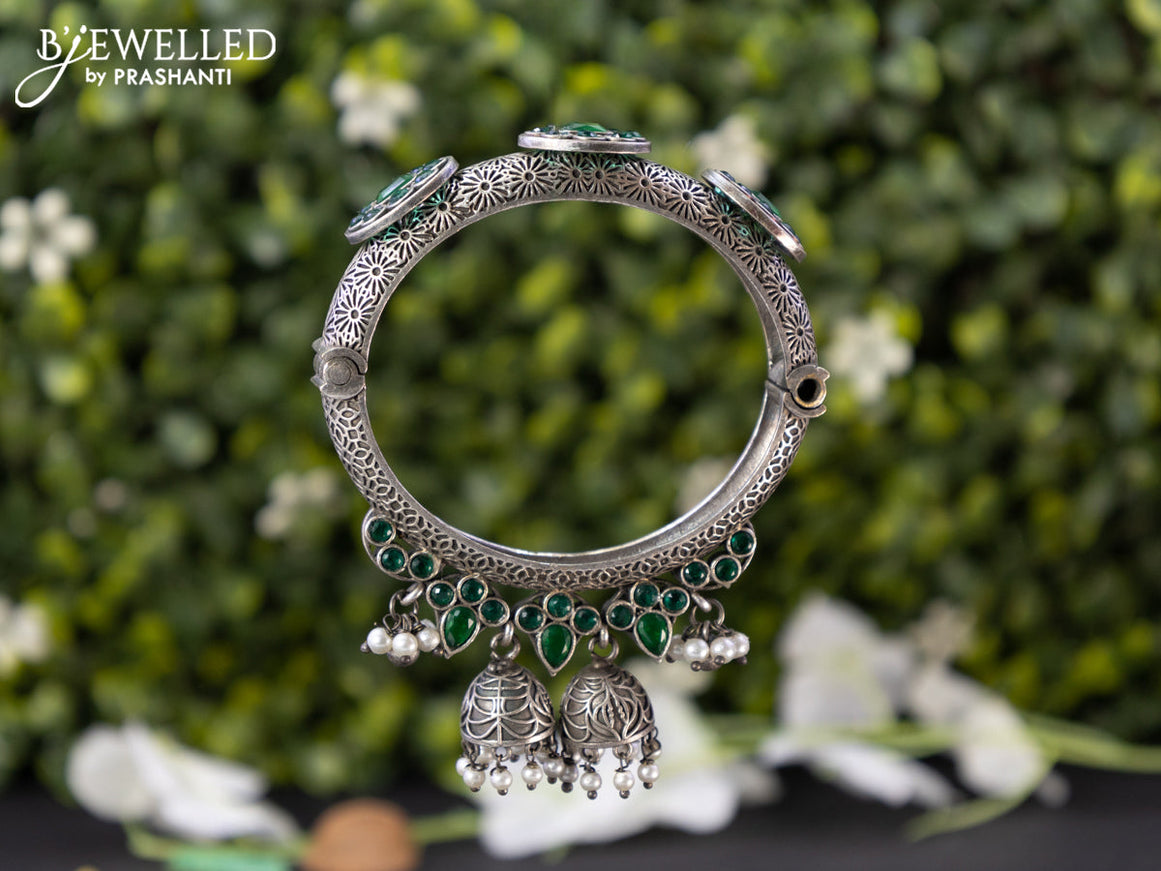 Oxidised screw type bangle with emerald stones and hangings