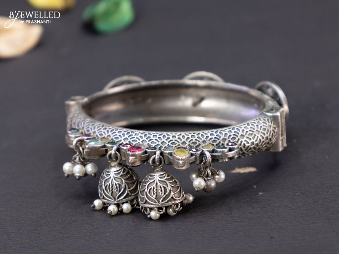 Oxidised screw type bangle with multicolour stones and hangings