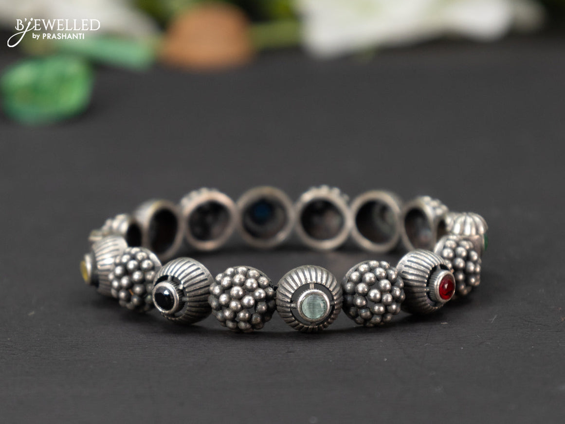 Oxidised screw type bangle with multicolour stones