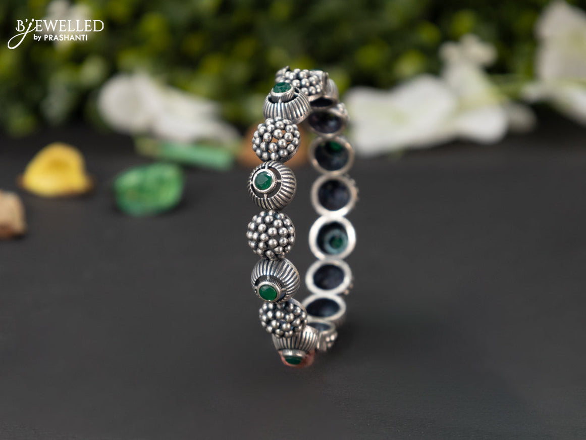 Oxidised screw type bangle with emerald stones