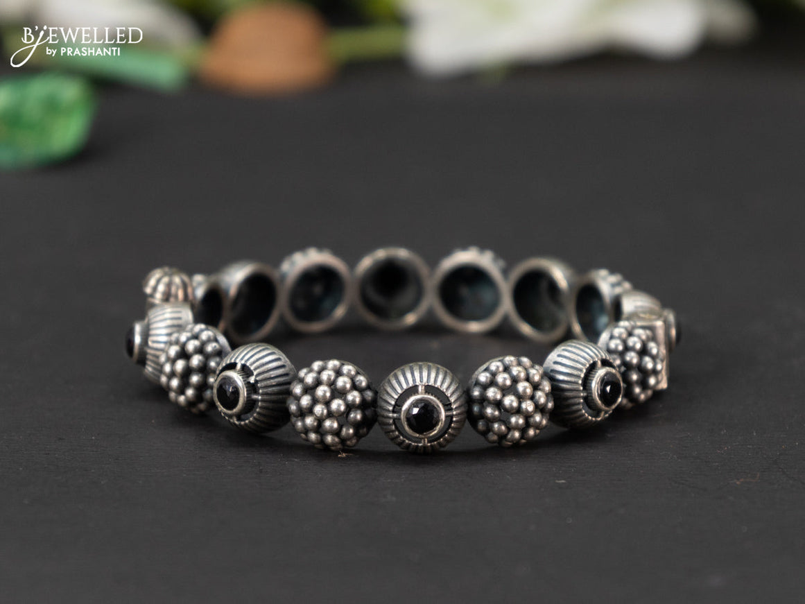 Oxidised screw type bangle with black stones