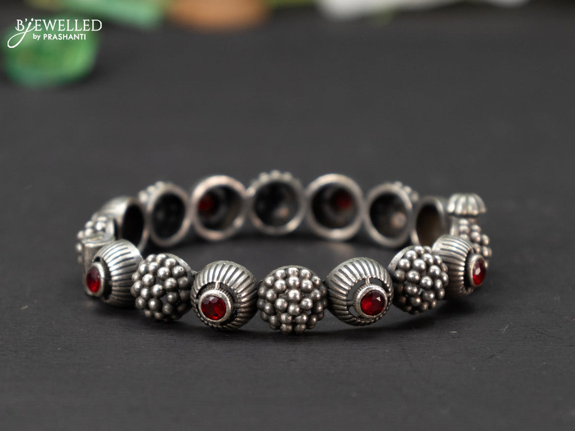 Oxidised screw type bangle with ruby stones