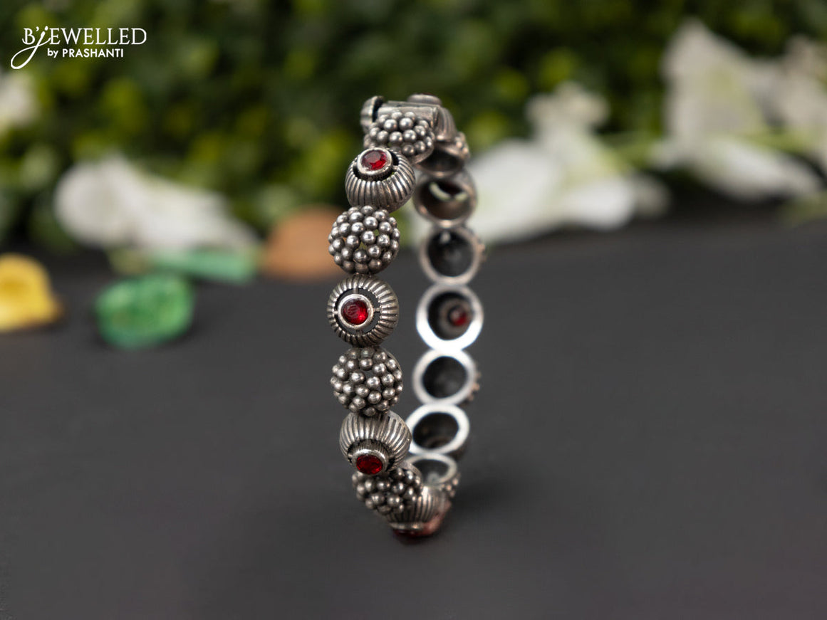 Oxidised screw type bangle with ruby stones