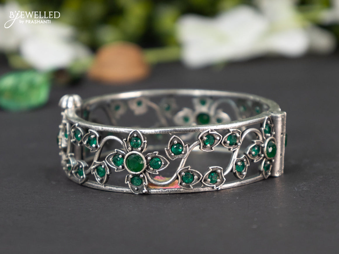 Oxidised screw type bangle with emerald stones