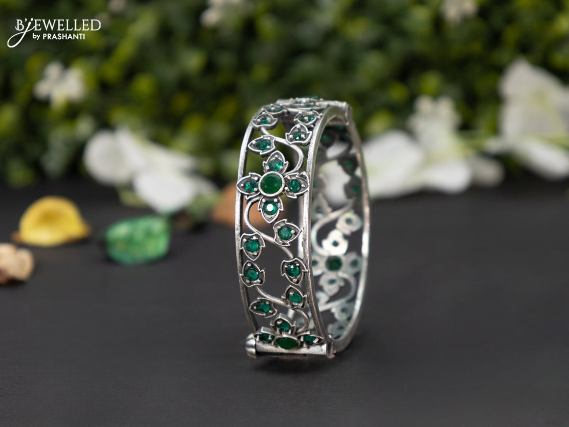 Oxidised screw type bangle with emerald stones