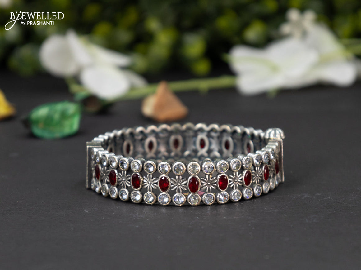 Oxidised screw type bangle with ruby and cz stones