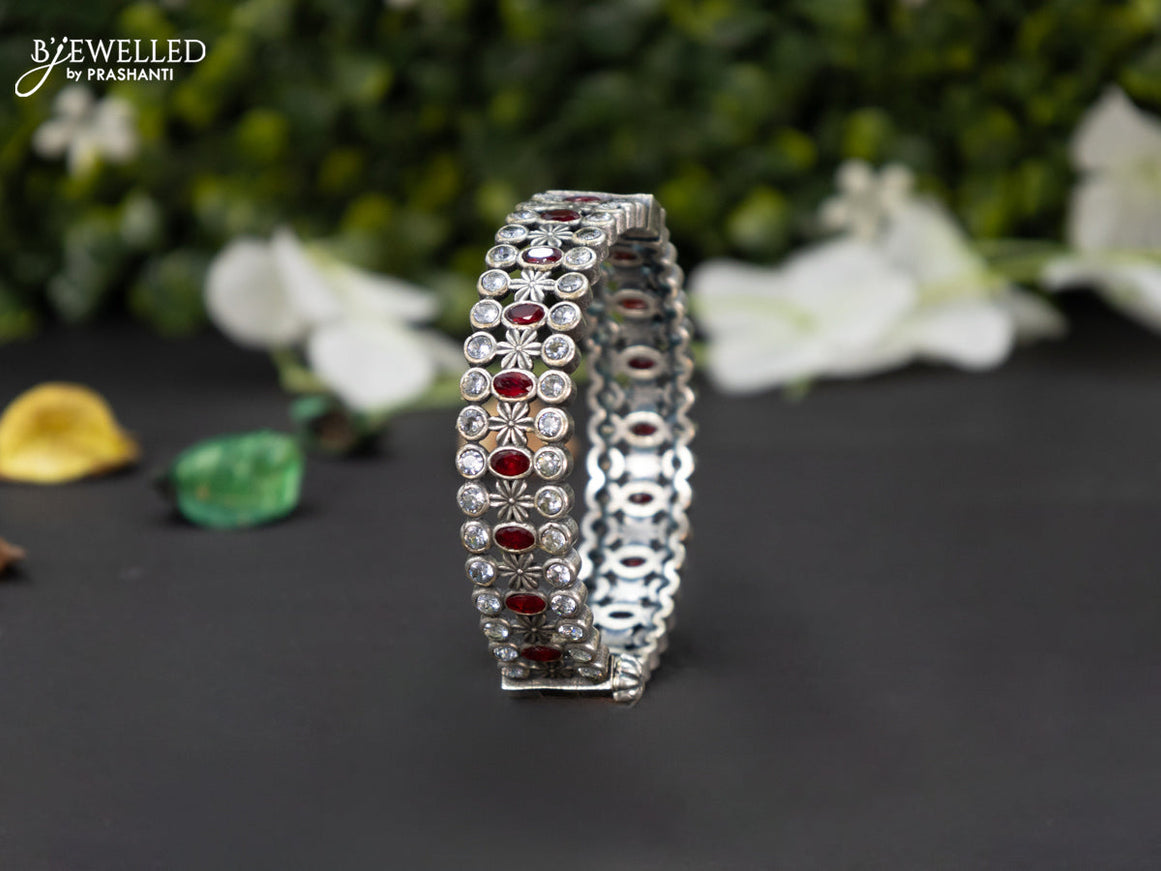 Oxidised screw type bangle with ruby and cz stones