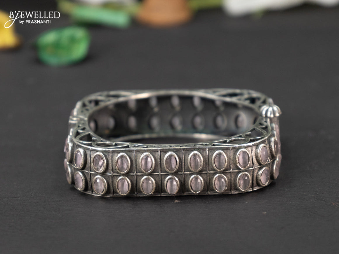 Oxidised screw type bangle with baby pink stones