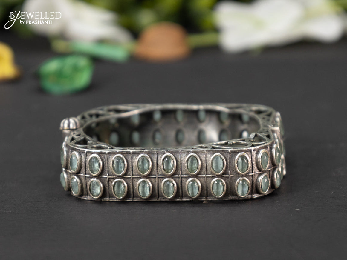 Oxidised screw type bangle with mint green stones