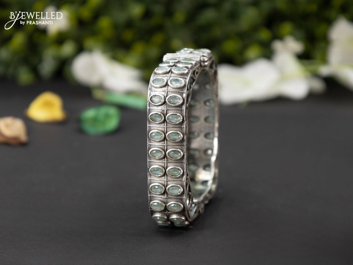 Oxidised screw type bangle with mint green stones