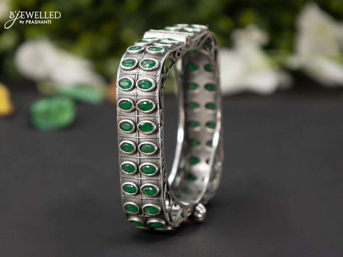 Oxidised screw type bangle with emerald stones