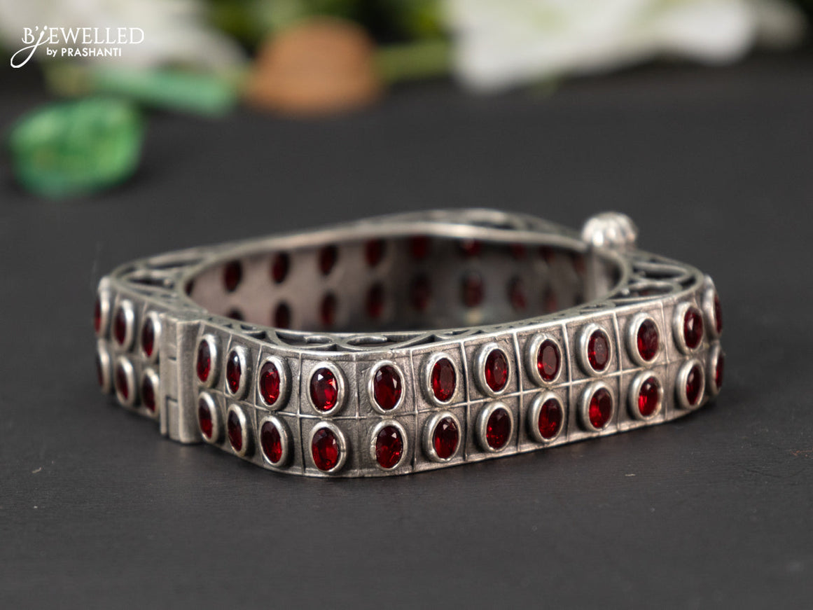 Oxidised screw type bangle with ruby stones