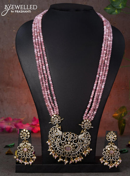 Beaded multi layer baby pink necklace peacock design with cz stones and beads hanging in victorian finish