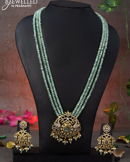 Beaded triple layer mint green necklace peacock design with cz stones and beads hanging in victorian finish
