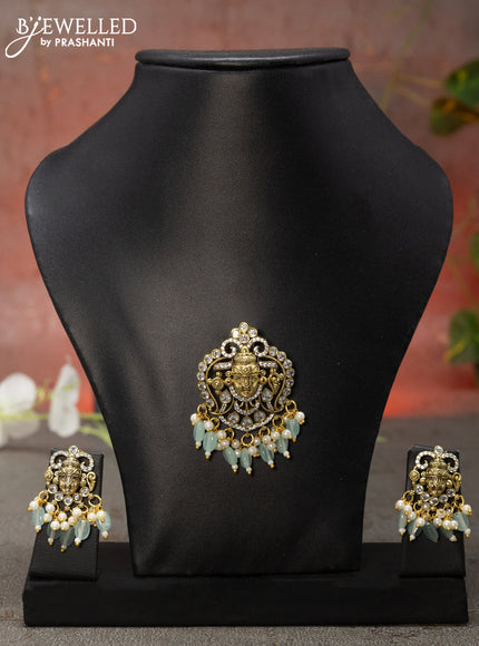 Victorian finish pendant set tirupati balaji design with cz stone and ice blue beads hanging