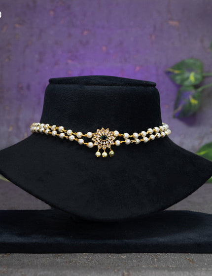 Pearl choker floral design with emerald and cz stones and pearl hangings