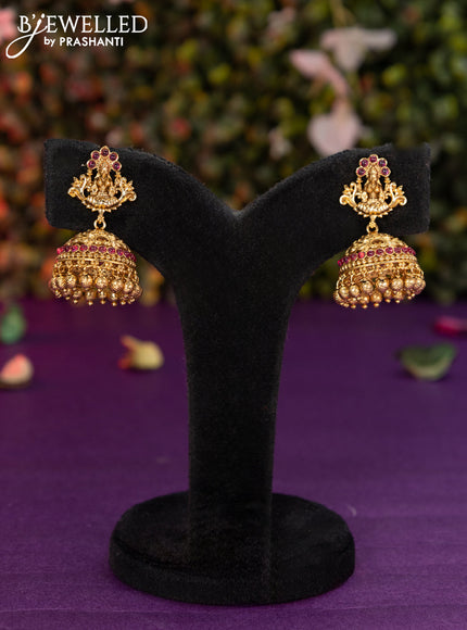 Antique jhumka lakshmi design with pink kemp stones and golden beads hangings