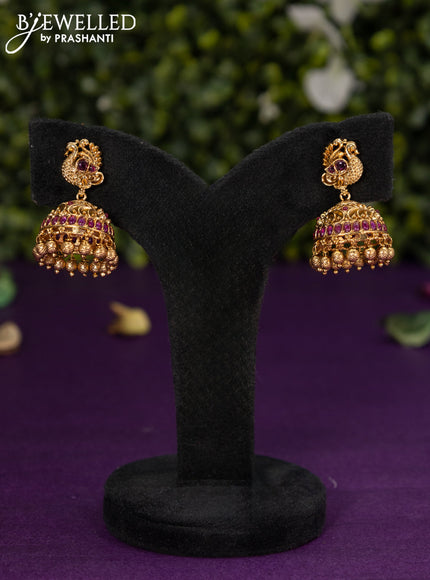 Antique jhumka peacock design with pink kemp stones and golden beads hangings