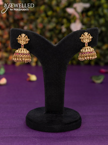 Antique jhumka lakshmi design with pink kemp stones and golden beads hangings