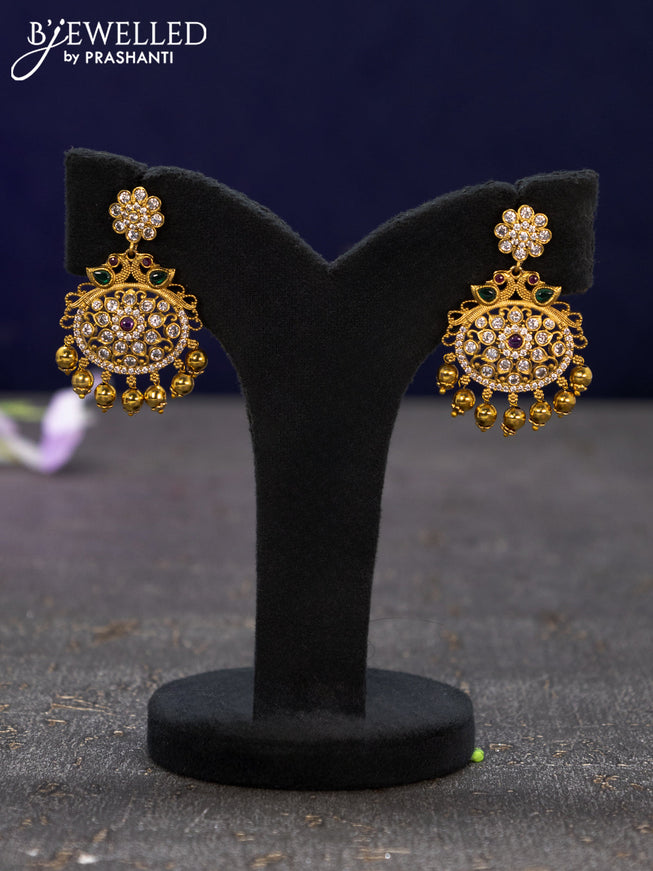 Antique earrings with kemp & cz stones and golden beads hangings