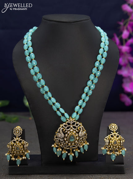 Beaded double layer light blue necklace swan design with cz stones and beads hanging in victorian finish