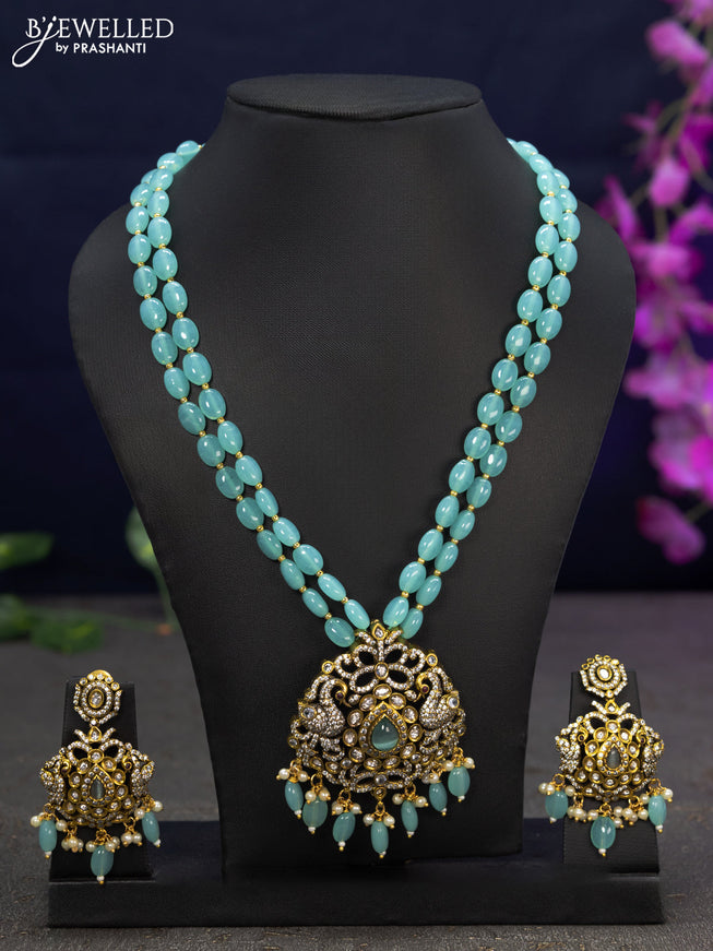 Beaded double layer light blue necklace swan design with cz stones and beads hanging in victorian finish