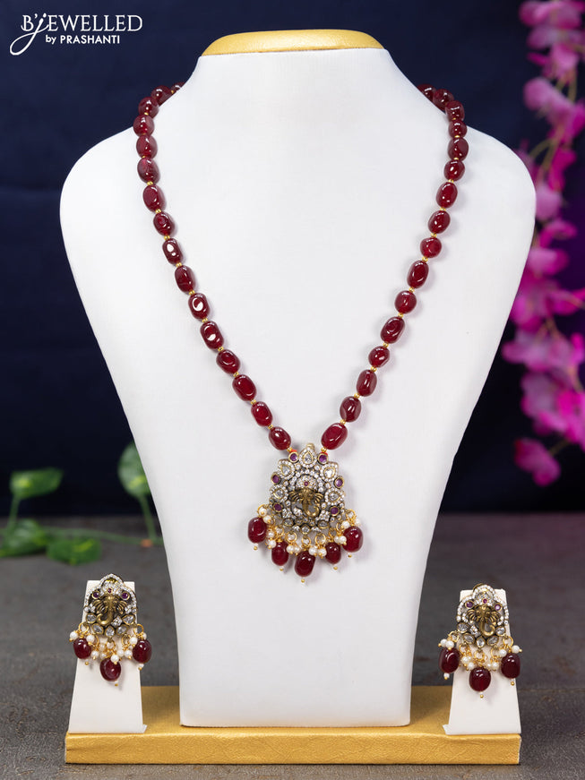 Beaded maroon necklace ruby & cz stones with ganesha pendant and beads hanging in victorian finish