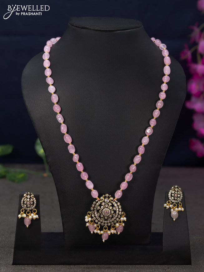 Beaded baby pink necklace with cz stones and beads hanging in victorian finish