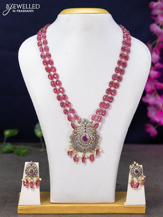 Beaded pink necklace with ruby & cz stones and beads hanging in victorian finish