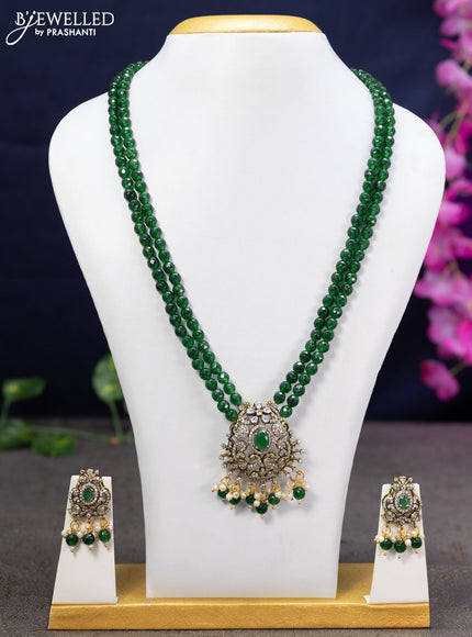 Beaded double layer green necklace with cz stones and beads hanging in victorian finish