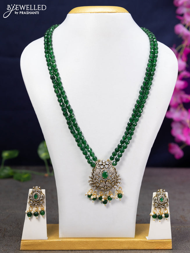 Beaded double layer green necklace with cz stones and beads hanging in victorian finish