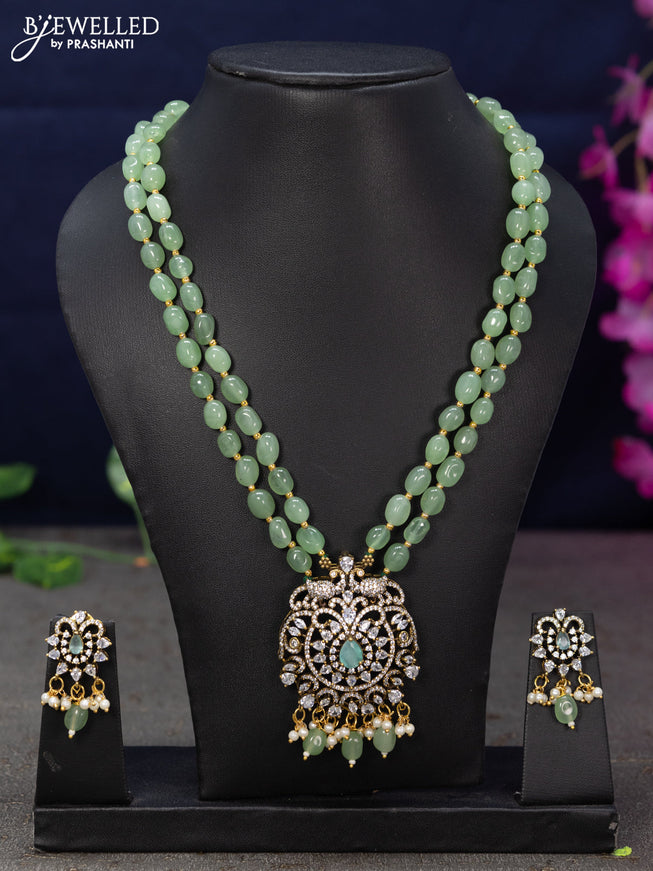 Beaded double layer mint green necklace with cz stones and beads hanging in victorian finish