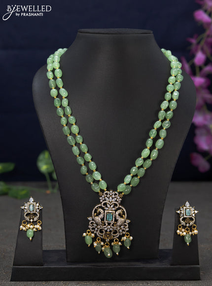 Beaded double layer mint green necklace with cz stones and beads hanging in victorian finish