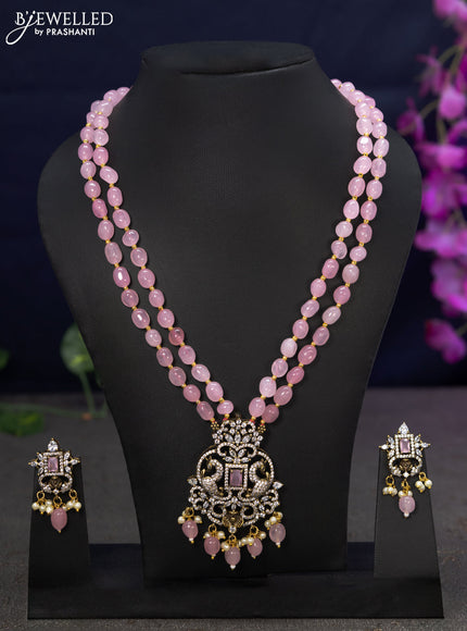 Beaded double layer baby pink necklace with cz stones and beads hanging in victorian finish