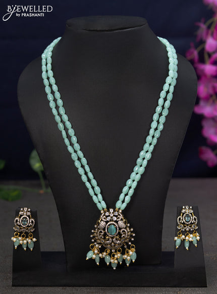 Beaded double layer mint green necklace with cz stones  and beads hanging in victorian finish