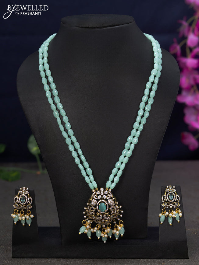 Beaded double layer mint green necklace with cz stones  and beads hanging in victorian finish